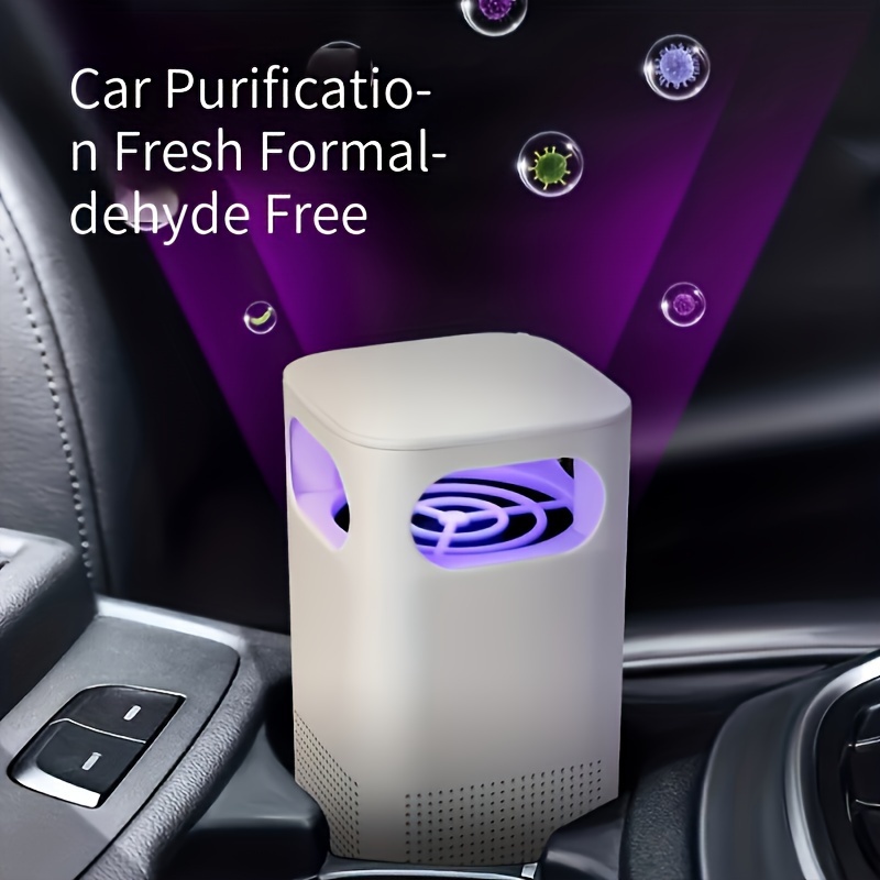 USB Air Purifier in office setting — placed on a desk next to a laptop and notebook