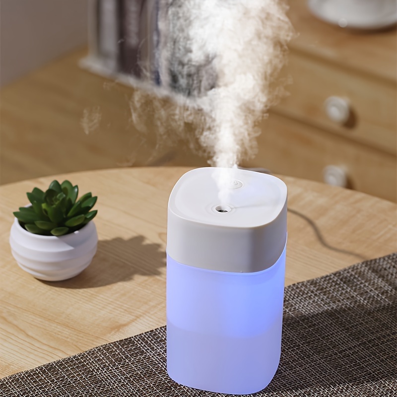 Portable mini humidifier with LED night light, USB-powered, 400 mL capacity — essential oil tray detail
