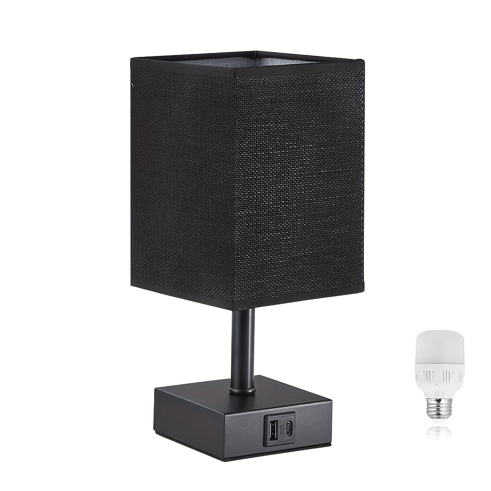 Bedside table lamp — front view, black metal base and linen shade